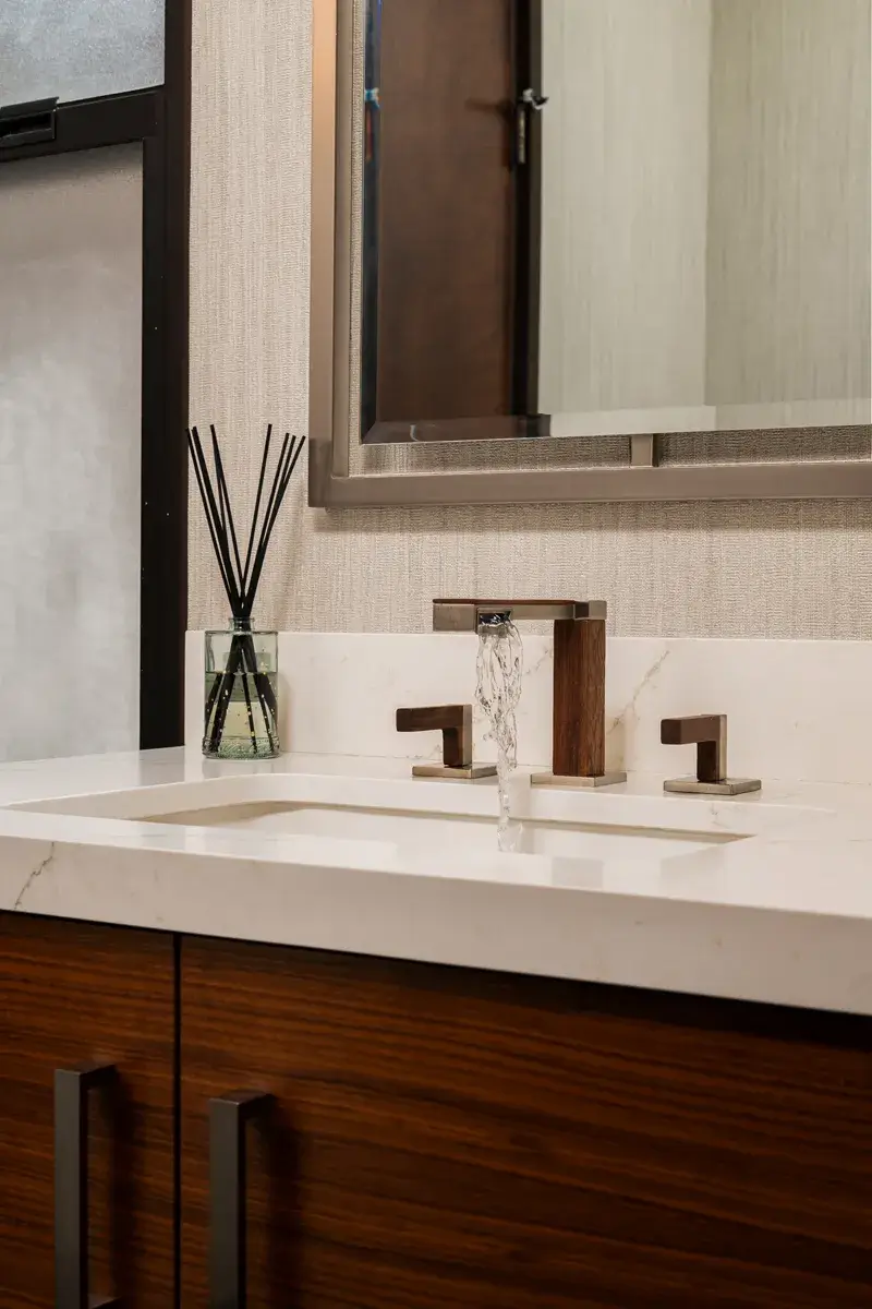 Sea-Pointe-Design-And-Remodel-white-undermount-sink-luxe-nickel-and-wood-widespread-bathroom-faucet