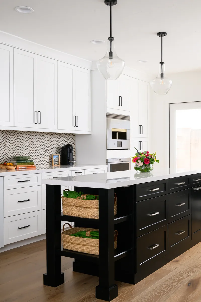 sea-pointe-design-and-remodel-two-clear-glass-pendants-sit-above-the-island