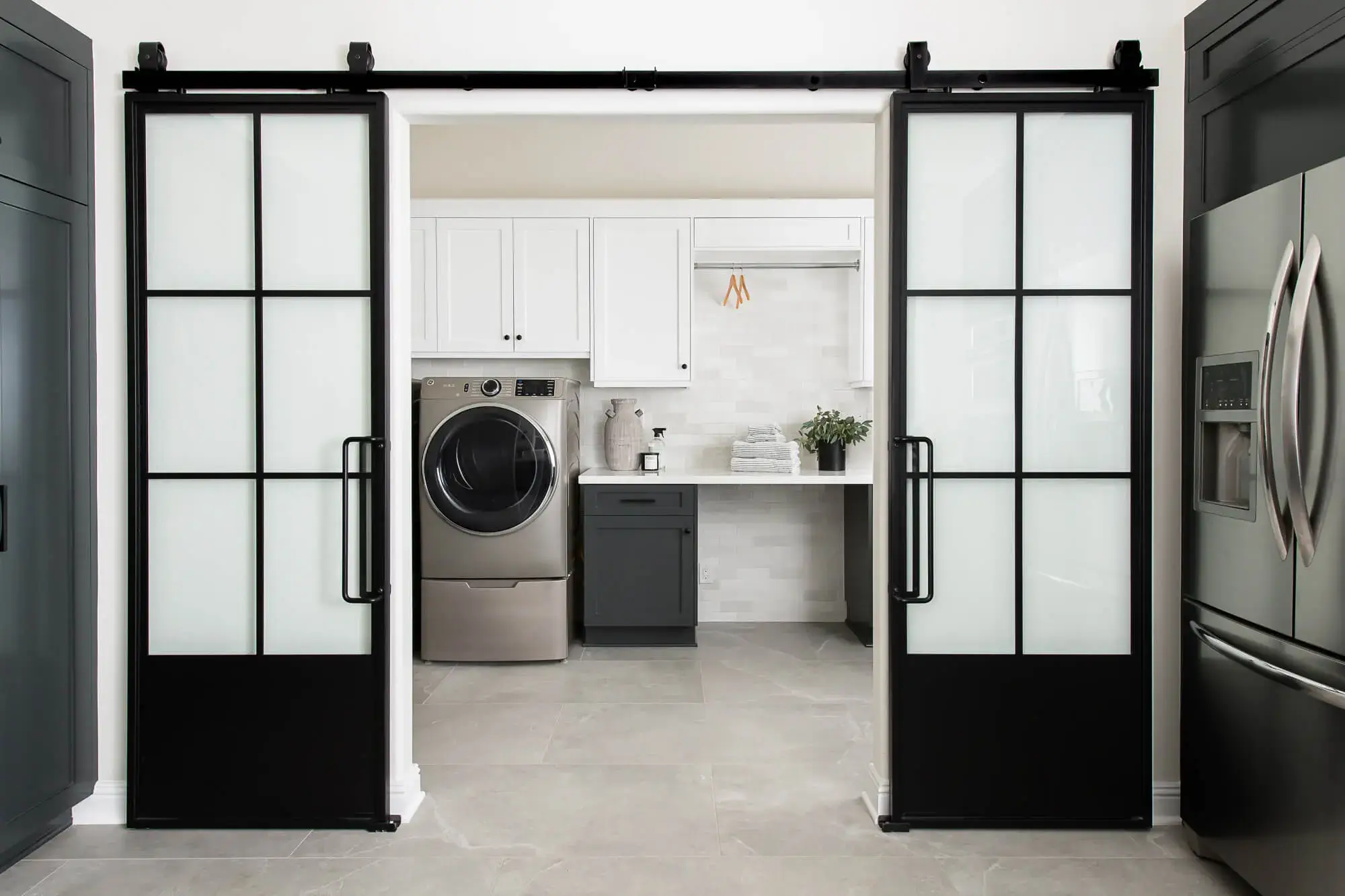 barn-door-track-sliding-system-new-laundry-room - laundry room design