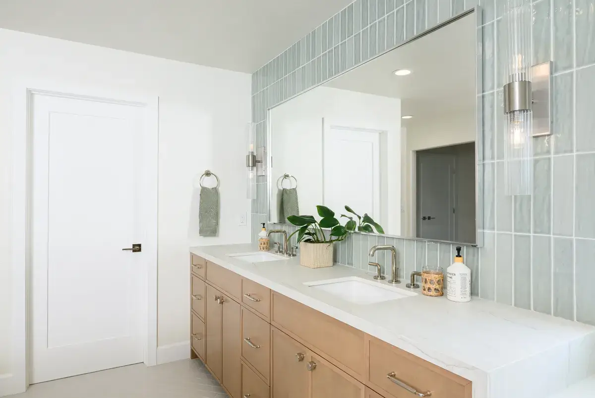 sea-pointe-design-and-remodel-Kohler-white-rectangular-undermount-sink-with-polished-nickel-widespread-faucets-and-custom-light-up-vanity-mirror