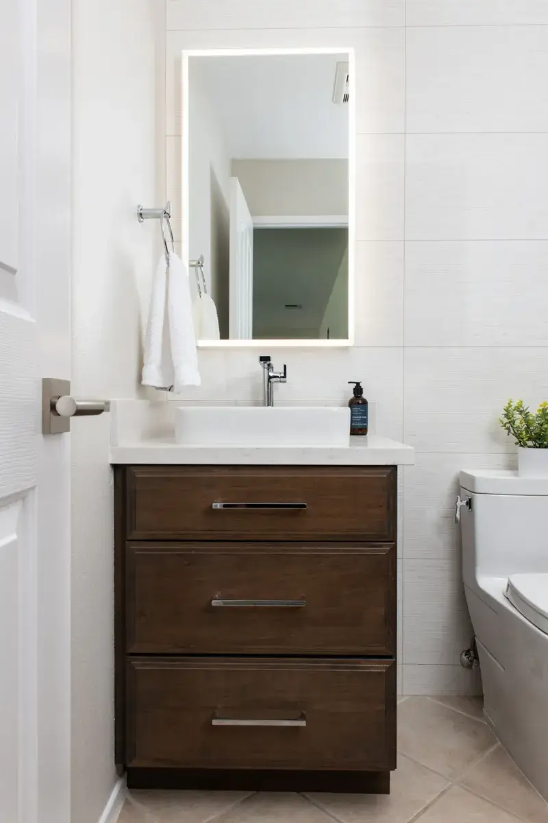 Better lighting and mirrors are simple bathroom updates that make a big impact