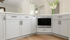 lower-perimeter-cabinets-and-island-by-Omega-in-a-Dove-finish