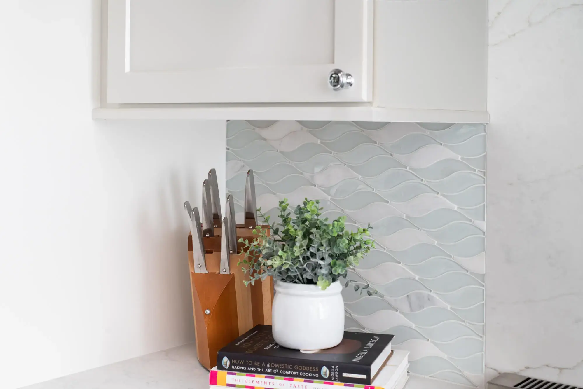 Elysium stone and glass backsplash in San Clemente kitchen remodel