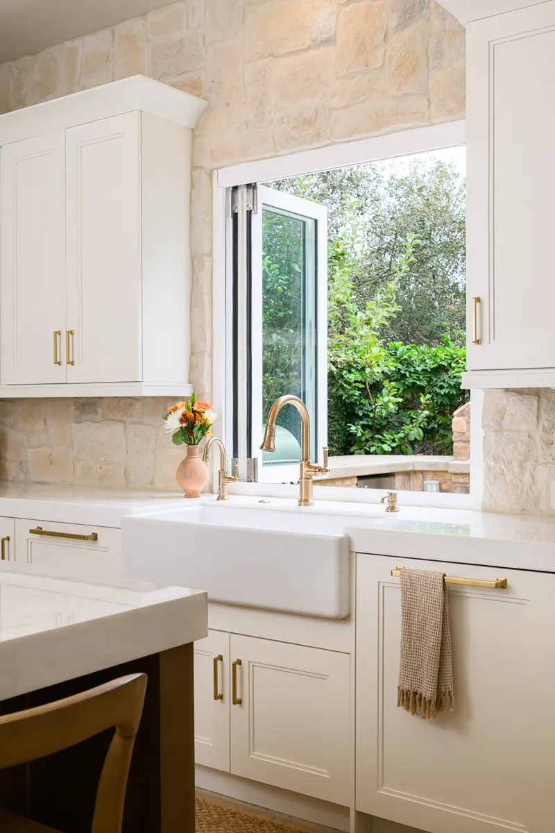 wash-area-features-a-white-farmhouse-sink-with-Smart-Touch-single-handle-pull-down-faucet-in-Luxe-Gold