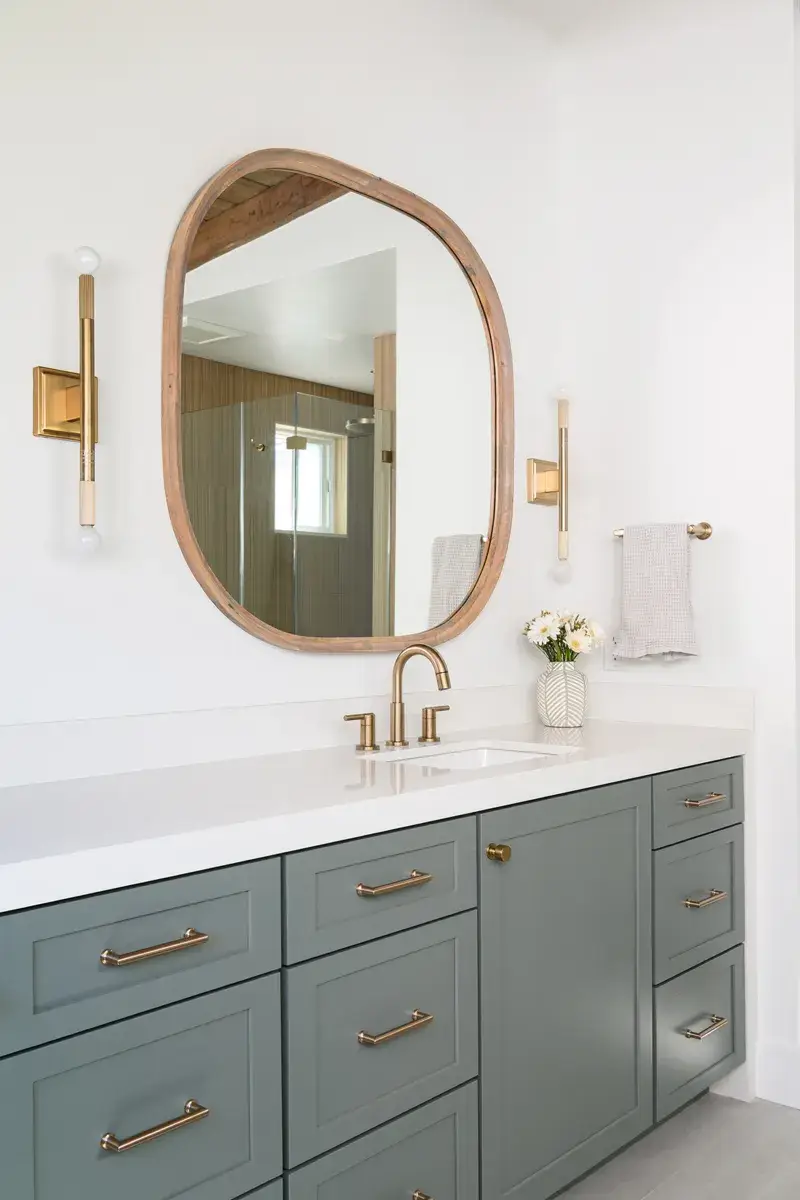 honey-bronze-knobs-accent-the-cabinetry-and-champagne-bronze-towel-hooks-add-convenience