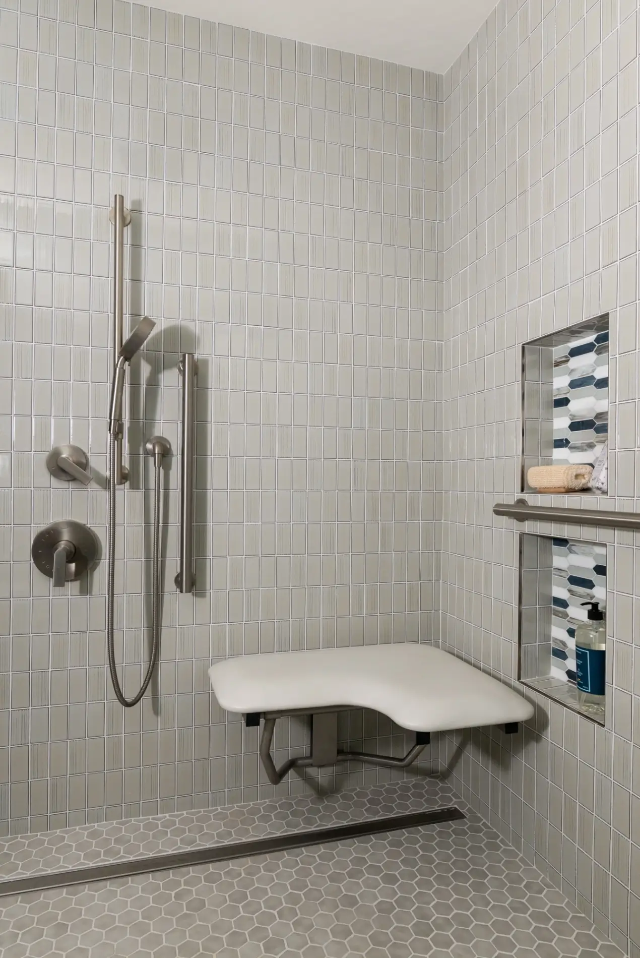 Built in shower benches and wall niches are often included in aging-in-place designs