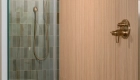 back-shower-wall-in-varying-shades-of-ceramic-Sage-with-matte-finish-tiles-flooring-decorated-in-penny-round-mosaic-matte-white-porcelain-tiles-with-linear-drai