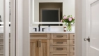 Primary-bathroom-remodel-including-newly-constructed-his-and-hers-closets-with-Calypso-Oak-LVP-flooring