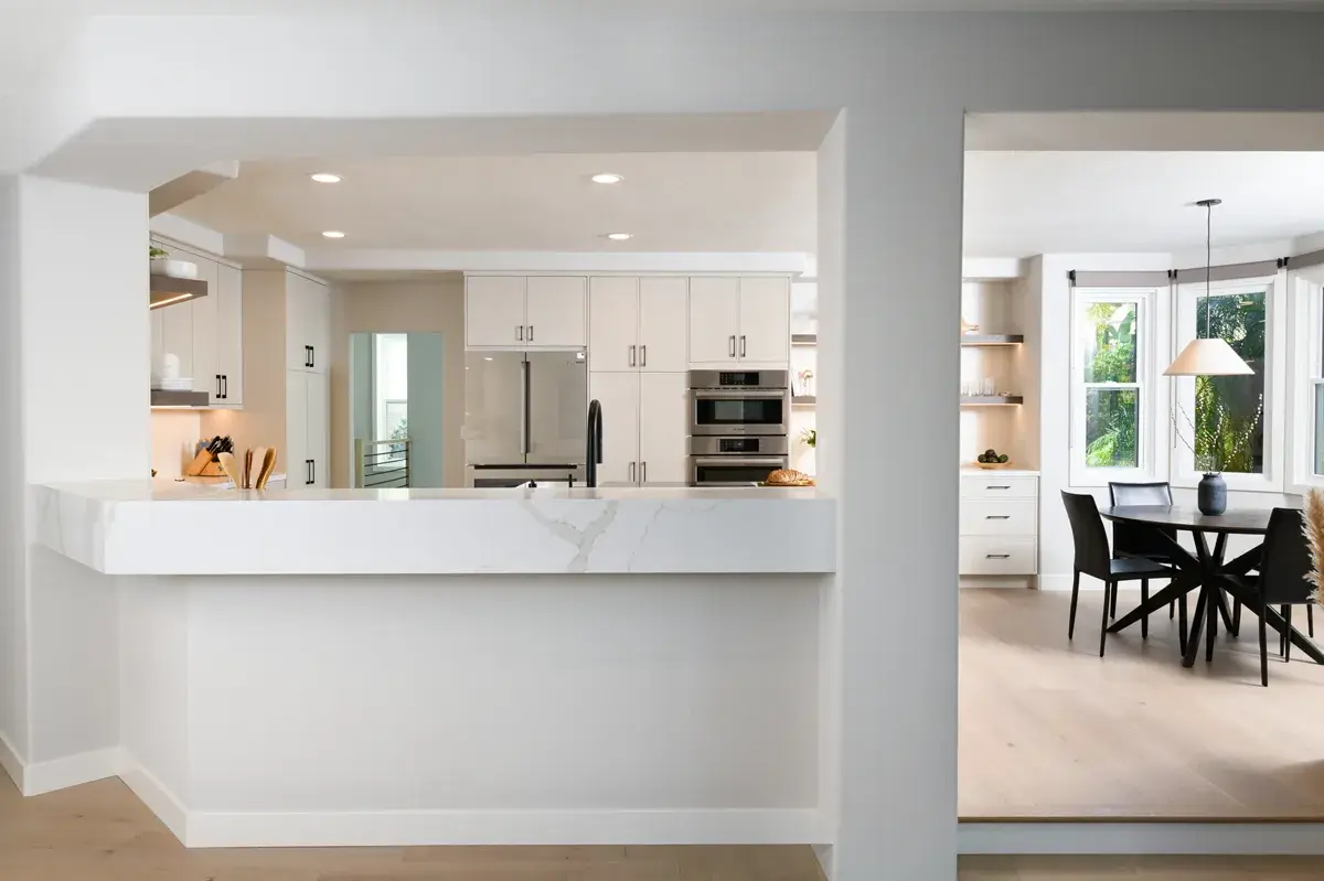 raised-bar-top-area-looks-into-kitchen-and-allows-for-additional-seating