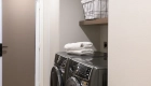 laundry-room-updates-include-Omega-floating-shelves-in-Riverbed-finish-new-electrical-and-plumbing-lines