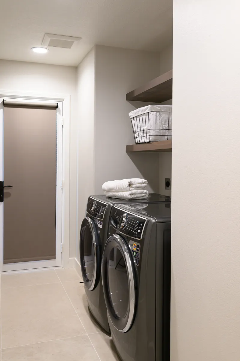 laundry-room-updates-include-Omega-floating-shelves-in-Riverbed-finish-new-electrical-and-plumbing-lines
