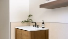 Natural-Oak-single-bathroom-vanity-with-matte-black-single-handle-faucet-for-washing-in-laundry-room