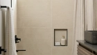 glazed-porcelain-shower-and-floor--and-backsplash-tiles-in-creme-finish-by-the-Thaddeus-series-in-horizontal-grid