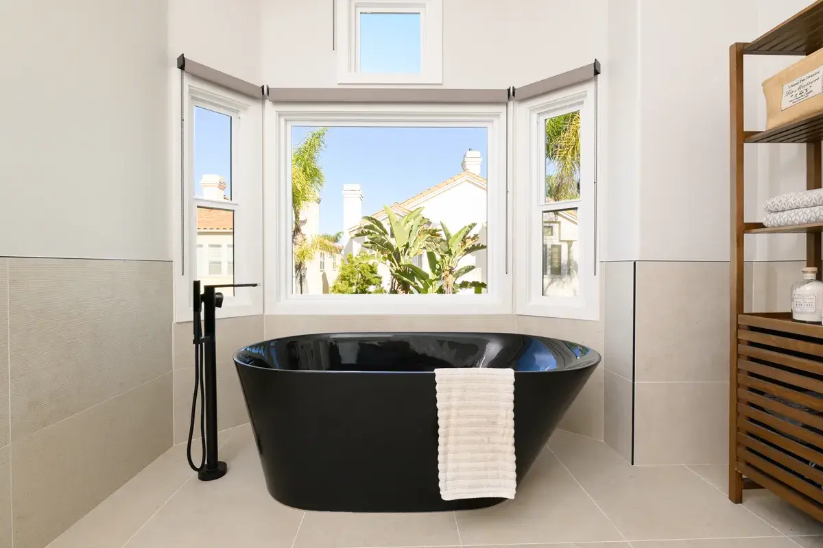 honed-black-freestanding-bath-tub-with-matte-black-floor-mount-tub-filler