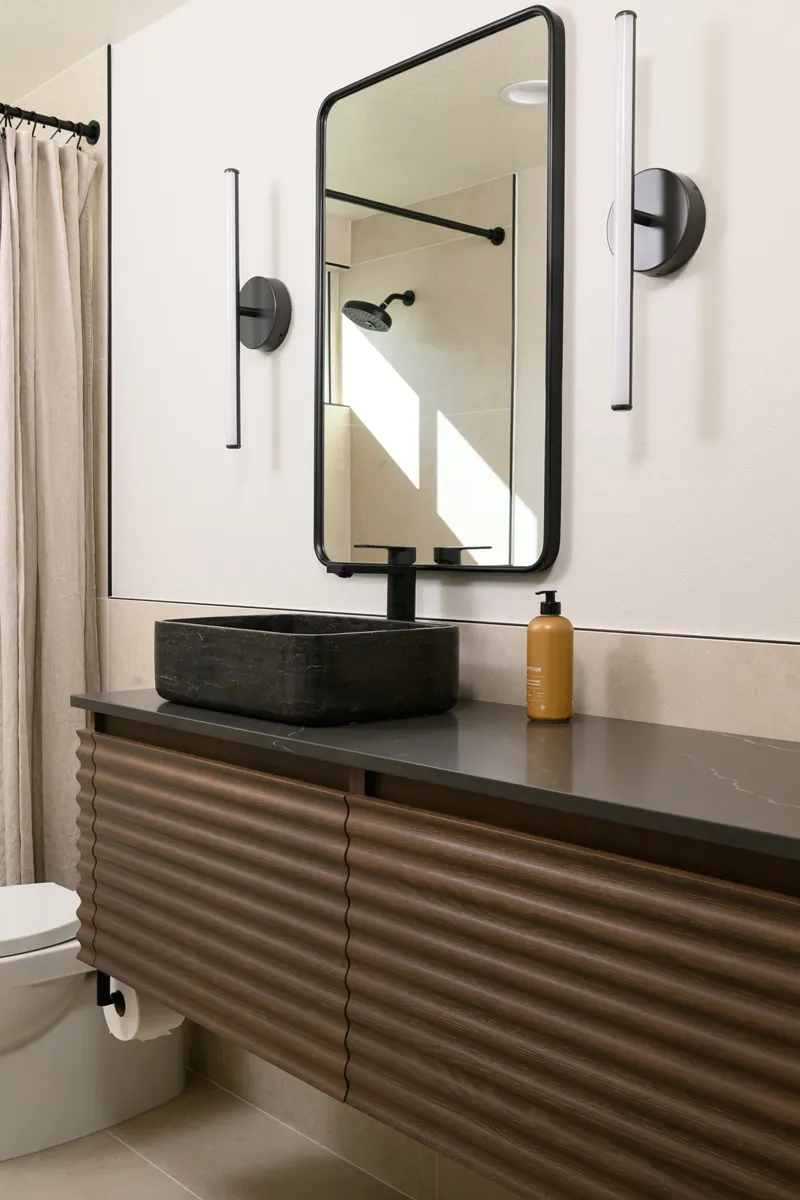 Dark-Bronze-mirror-and-LED-sconce-lighting