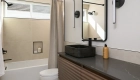 Ocala-floating-chestnut-bathroom-vanity-with-built-in-black-vessel-sink-and-matte-black-single-handle-faucet