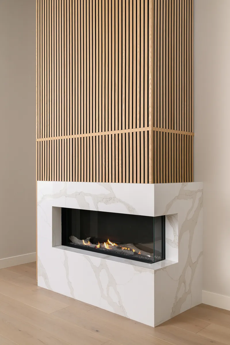 fireplace-surrounded-in-polished-quartz-in-Aurum