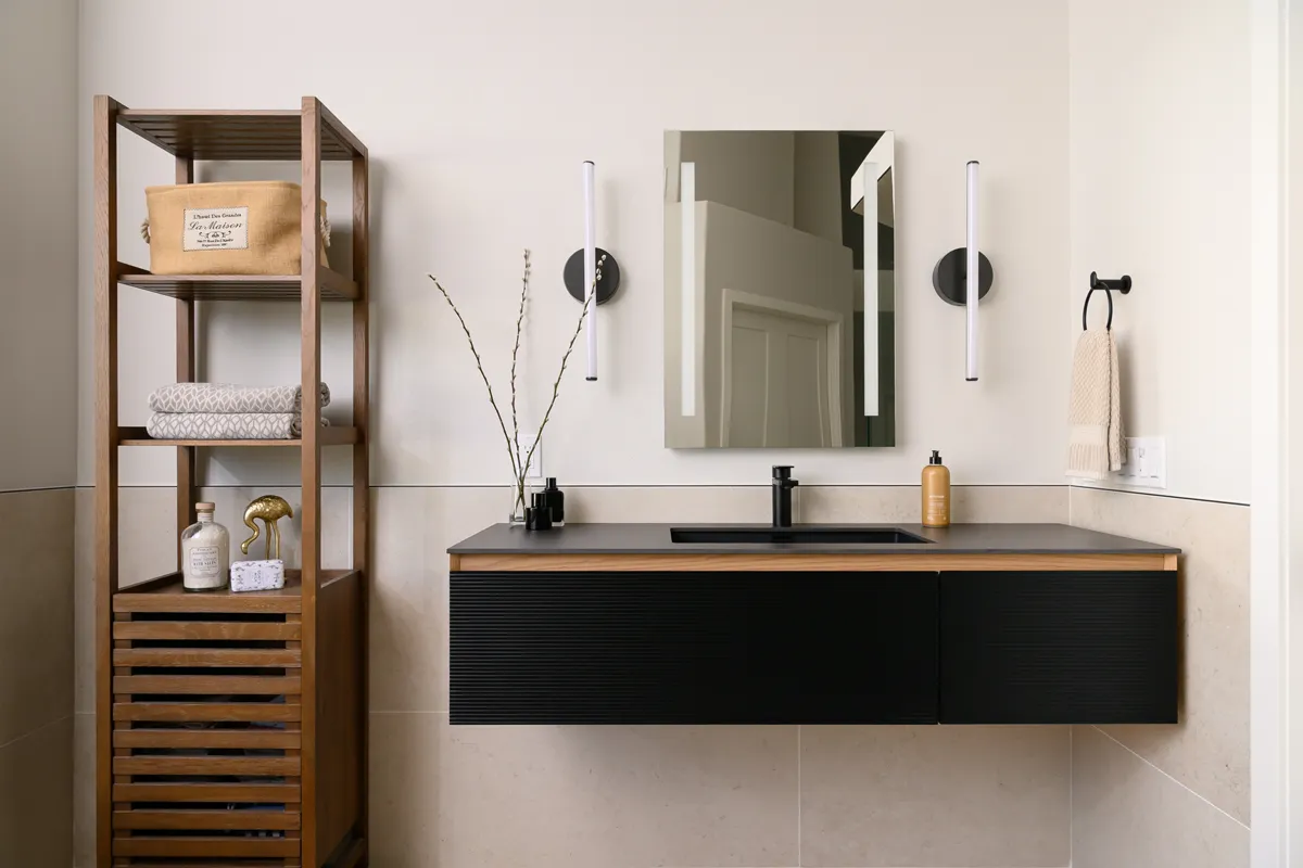 his-and-hers-seperate-vanity-areas-with-LED-mirrors-and-West-Elm-LED-light-rods