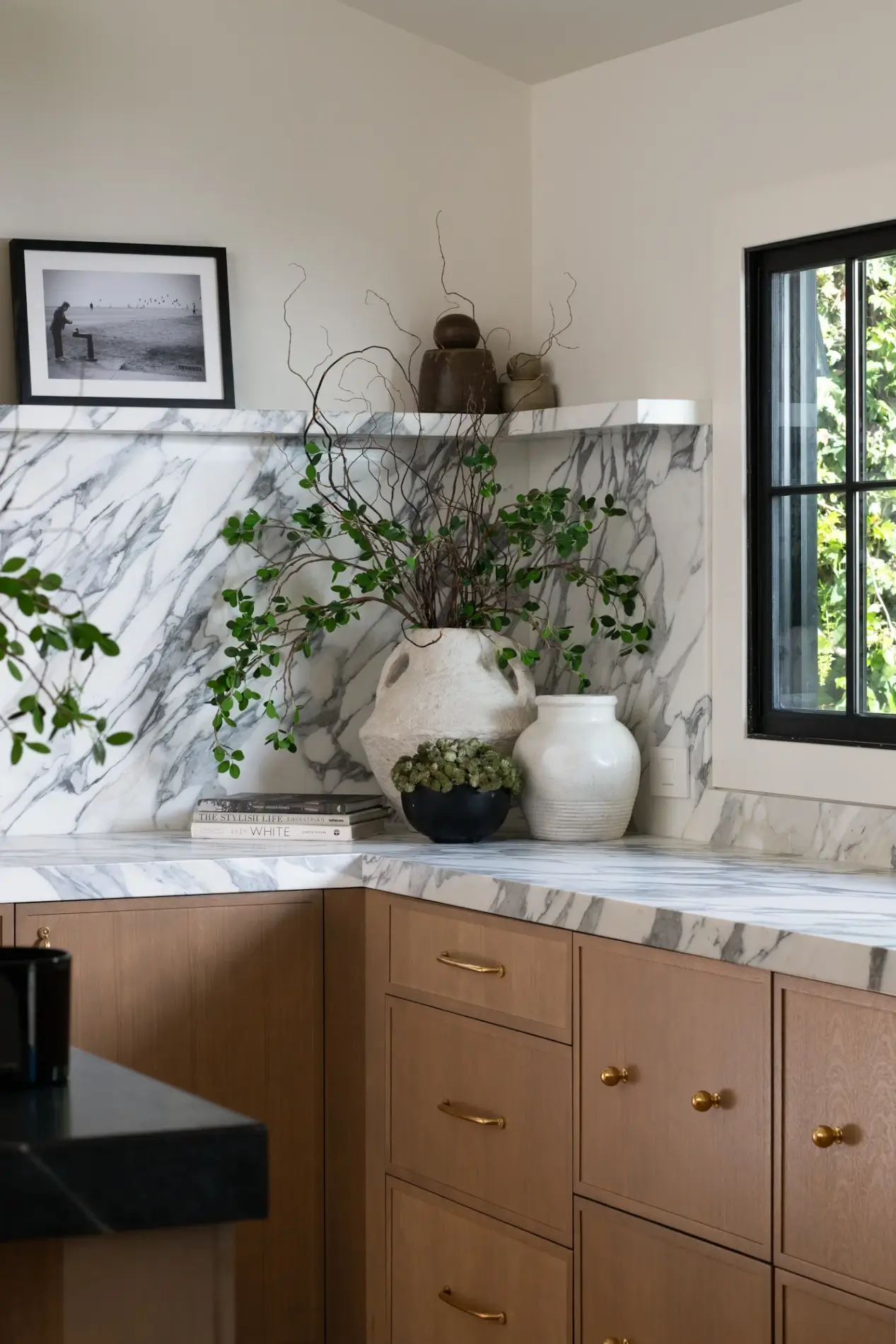 perimeter-countertops-and-backsplash-are-a-polished-marble-in-Arabescato-Corchia
