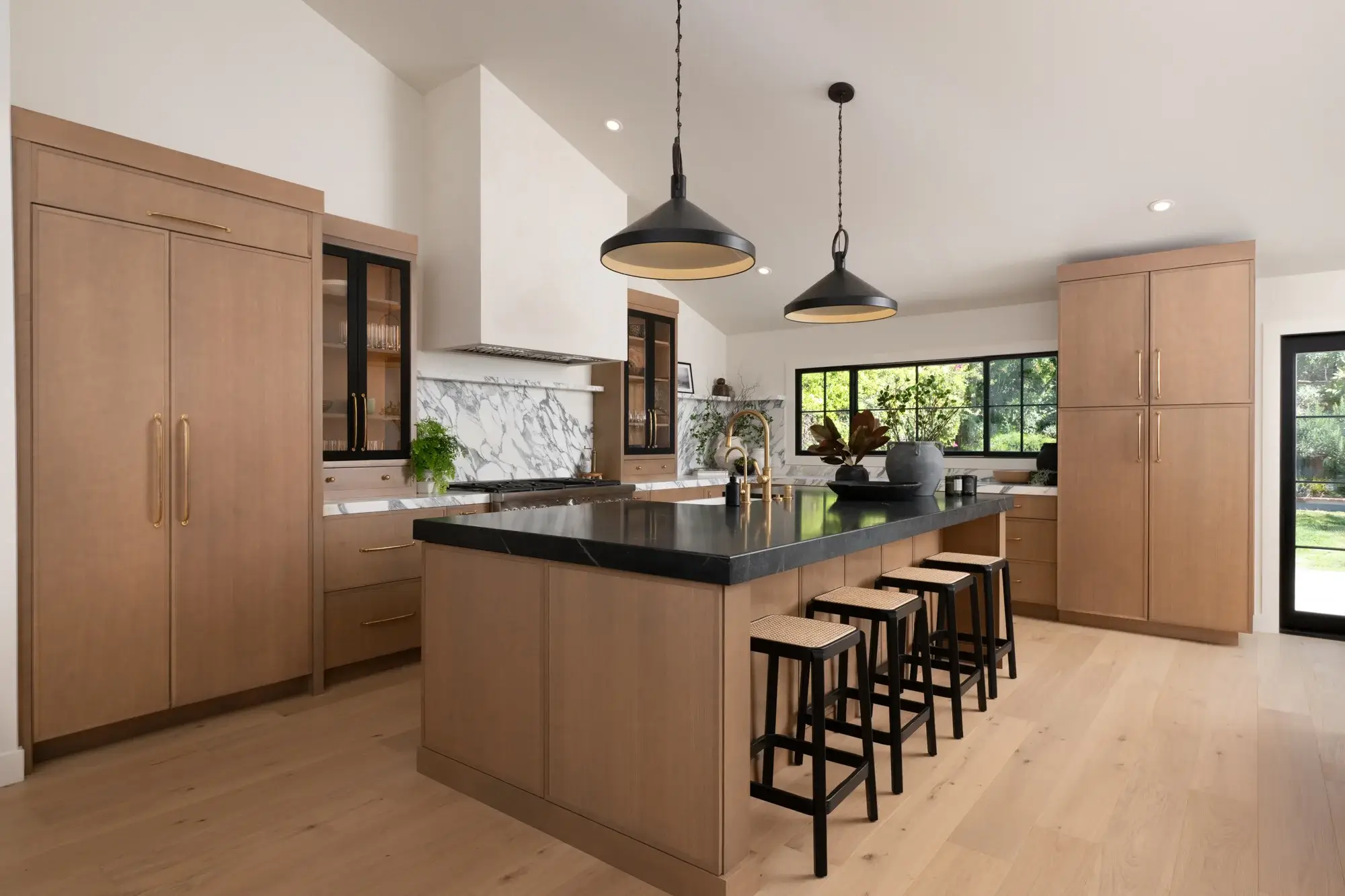 two-black-pendants-sit-above-the-island