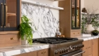 custom-Micro-Cement-hood-in-Chantilly-Lace-finish-sits-above-range