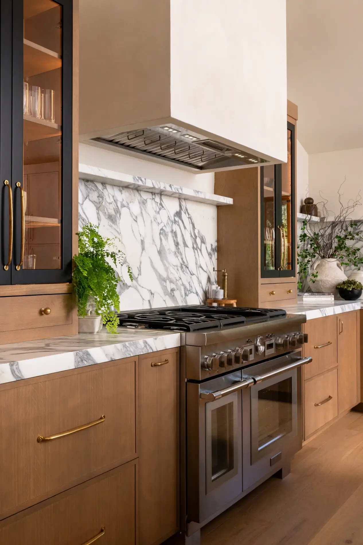 custom-Micro-Cement-hood-in-Chantilly-Lace-finish-sits-above-range