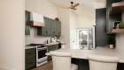 lighting-was-updated-from-2-small-lights-to-recessed-lighting-throughout-the-kitchen-and-dining-area-plus-a-black-and-honey-ceiling-fan-to-capture-the-natural-breeze