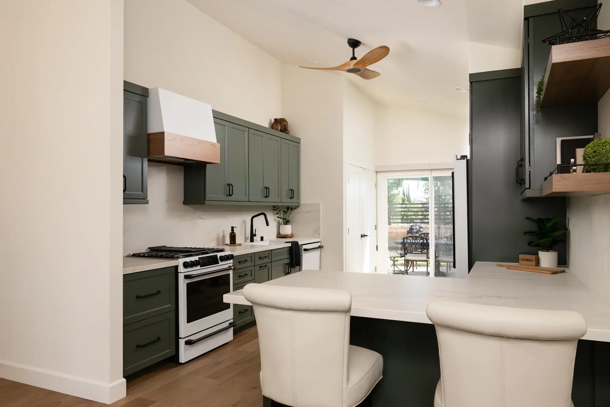lighting-was-updated-from-2-small-lights-to-recessed-lighting-throughout-the-kitchen-and-dining-area-plus-a-black-and-honey-ceiling-fan-to-capture-the-natural-breeze