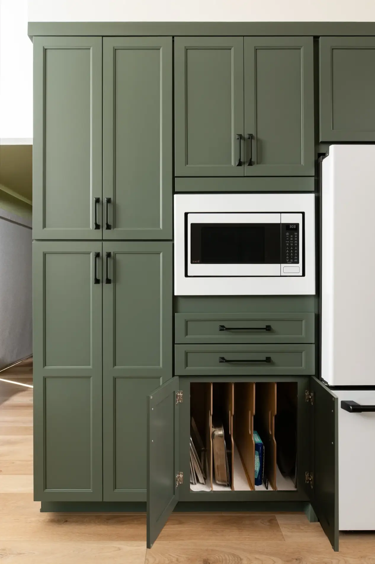 custom-storage-options-include-wood-tray-dividers-in-cabinet-under-mircowave-utensile-tray-and-shallow-drawer-dividers-and-Lemans-organizer-in-blind-corner-cabinet