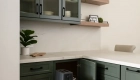 two-wood-floating-shelves-with-gallery-railings-add-storage-options-and-visual-interest