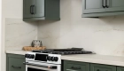 custom-decorative-appliance-hood-adds-character-in-white-with-a-natural-wood-trim