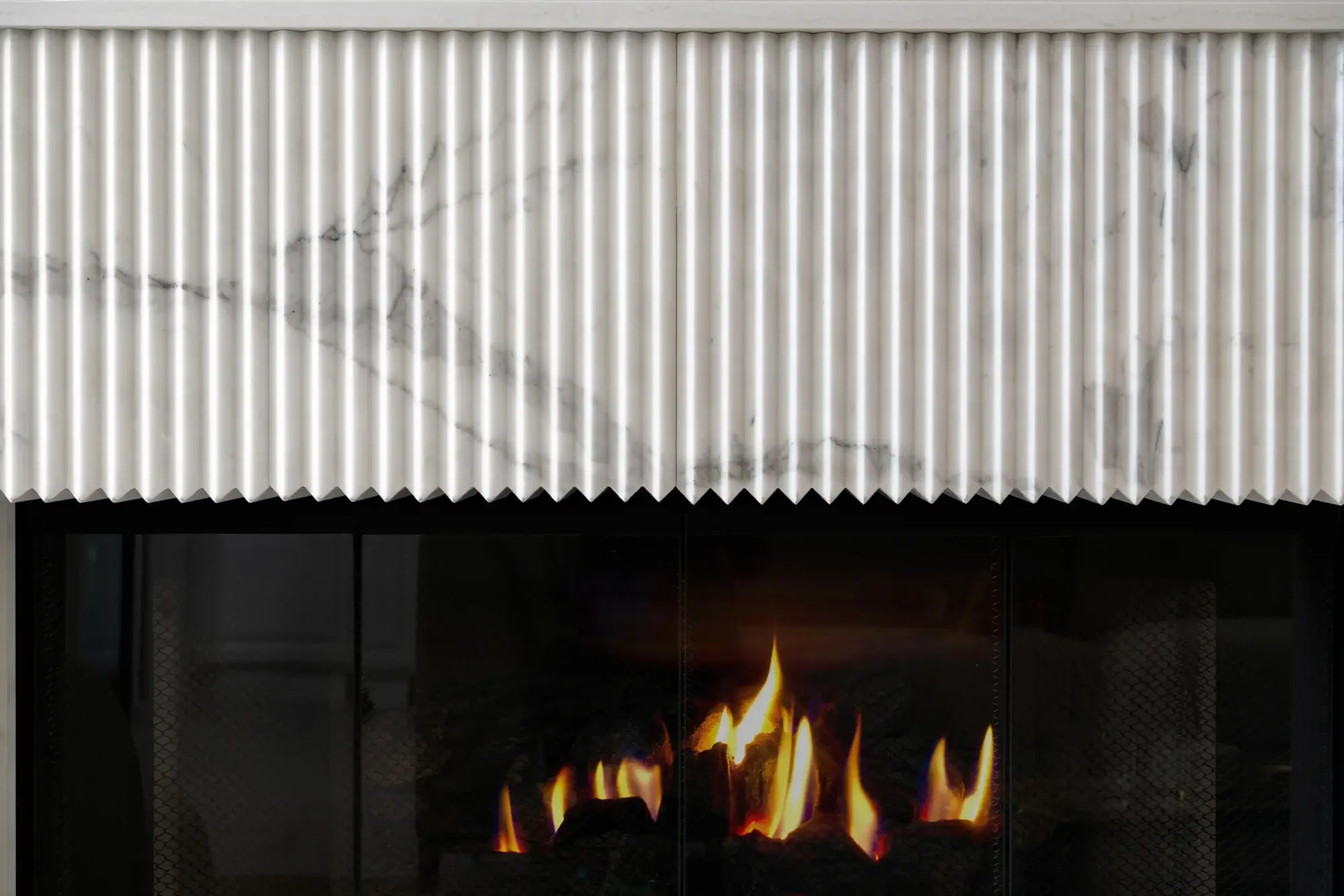Calacatta-gold-honed-marble-tile-fireplace-hearth-and-face