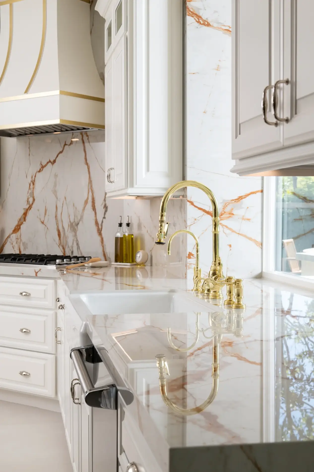 Waterstone-traditional-pulldown-faucet-with-lever-handles-in-polished-brass