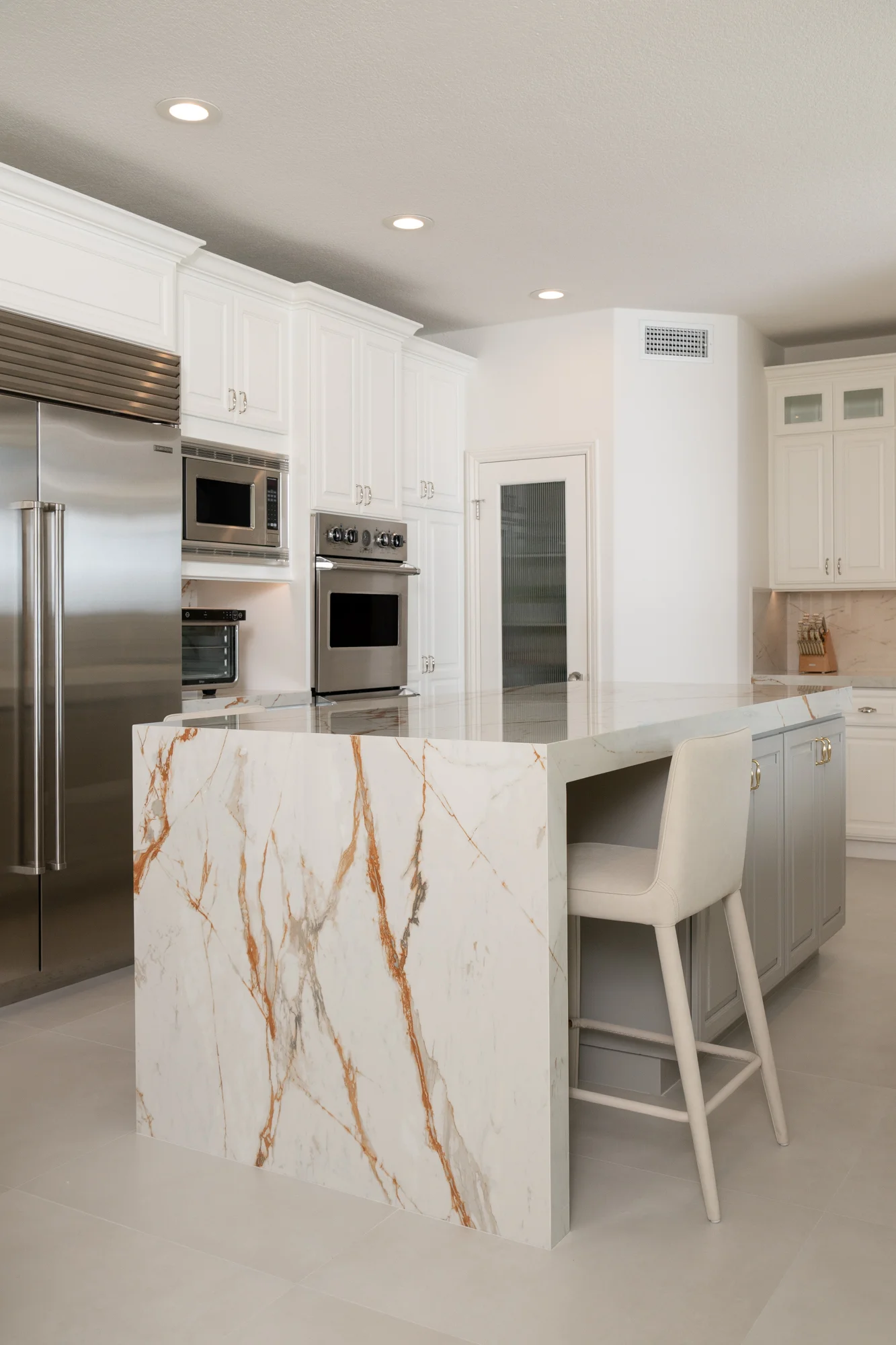 polished-Dekton-island-countertops-in-Awake-finish-with-waterfall-sides