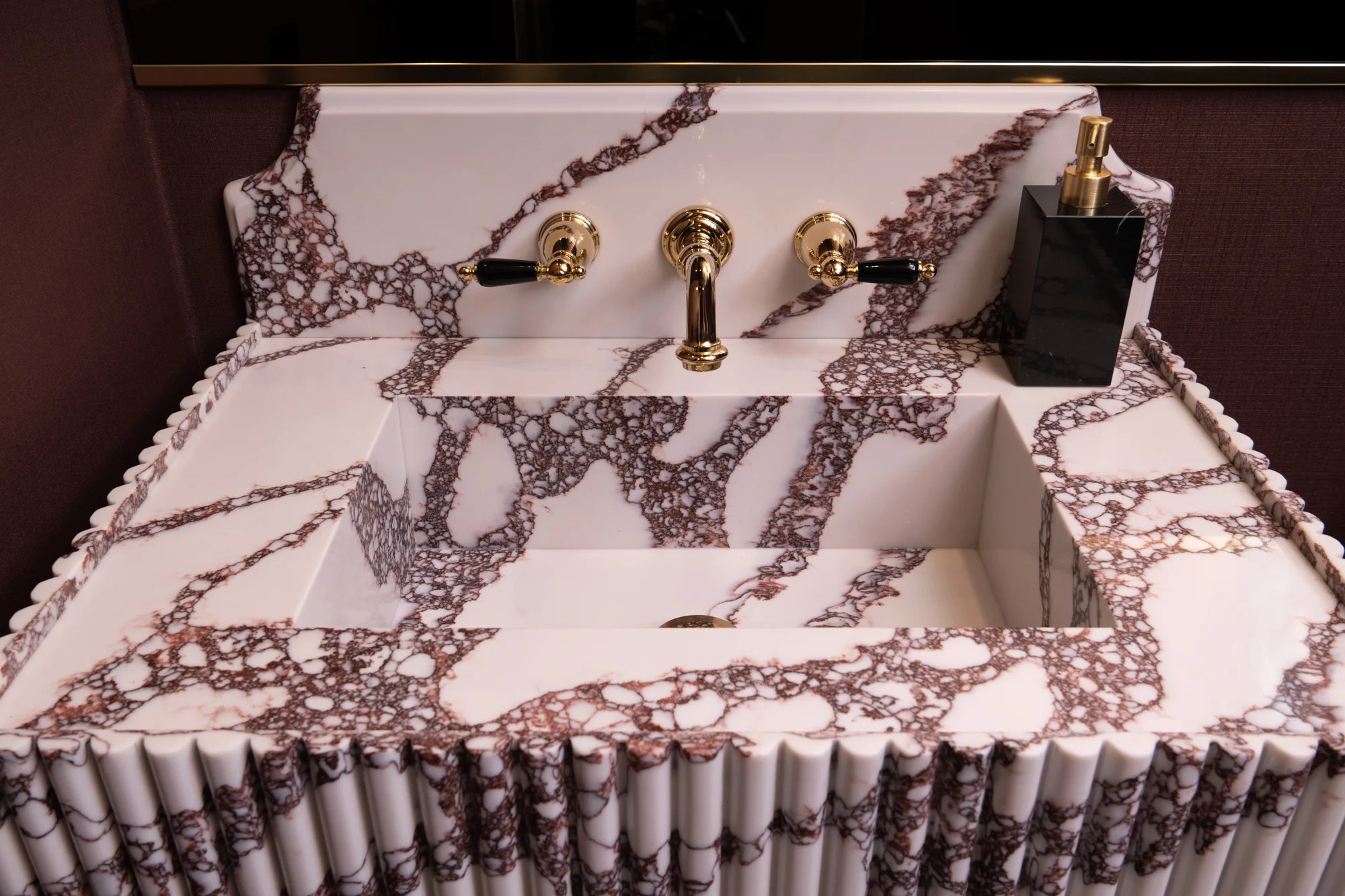 custom-quartz-floating-vanity-with-integral-sink-and-backsplash-in-polished-Crimson-Peak