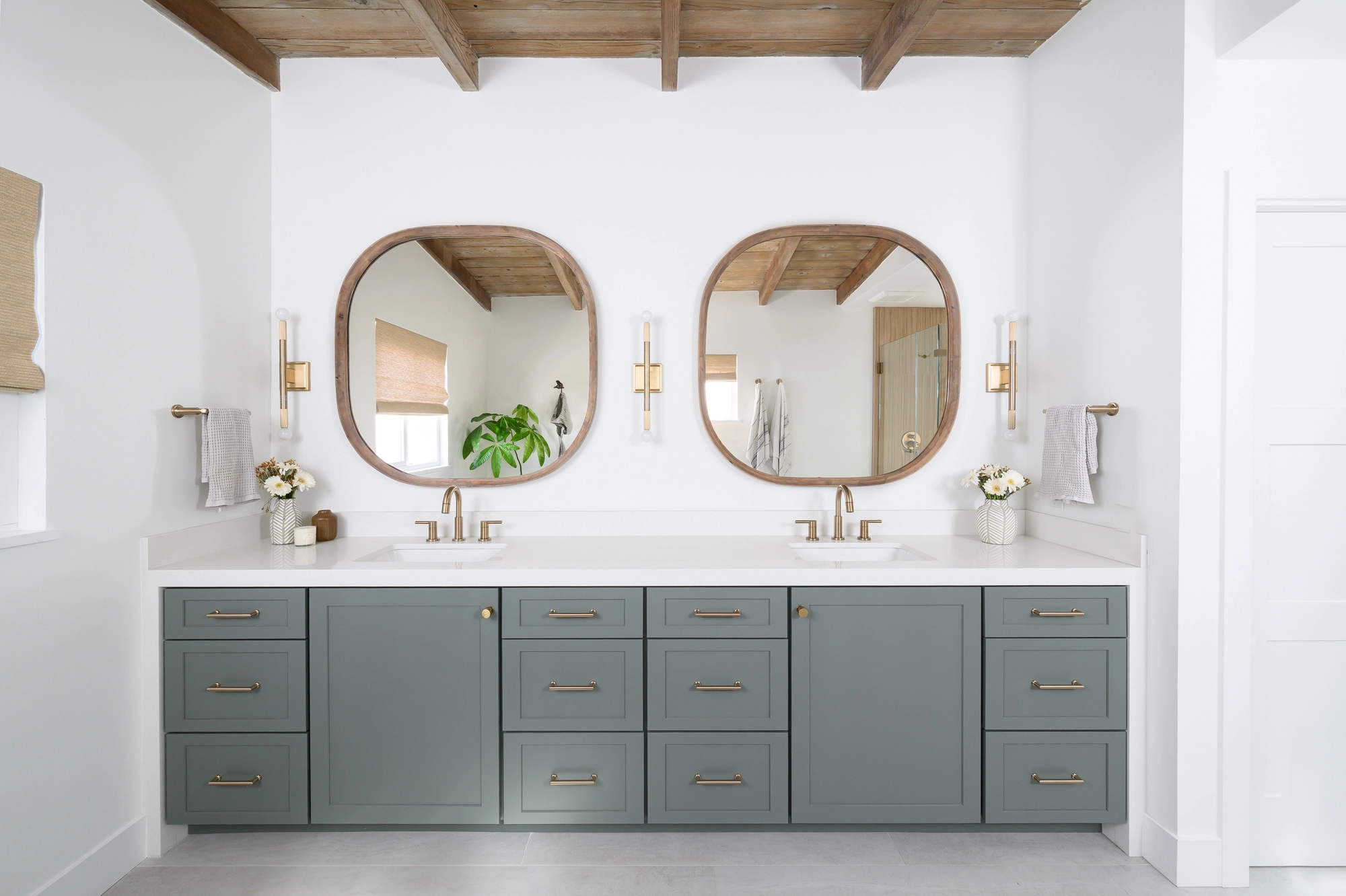 the-two-islands-and-bar-cabinetry-by-Omega-in-a-custom-paint-color-with-brass-inlays-on-end-panels