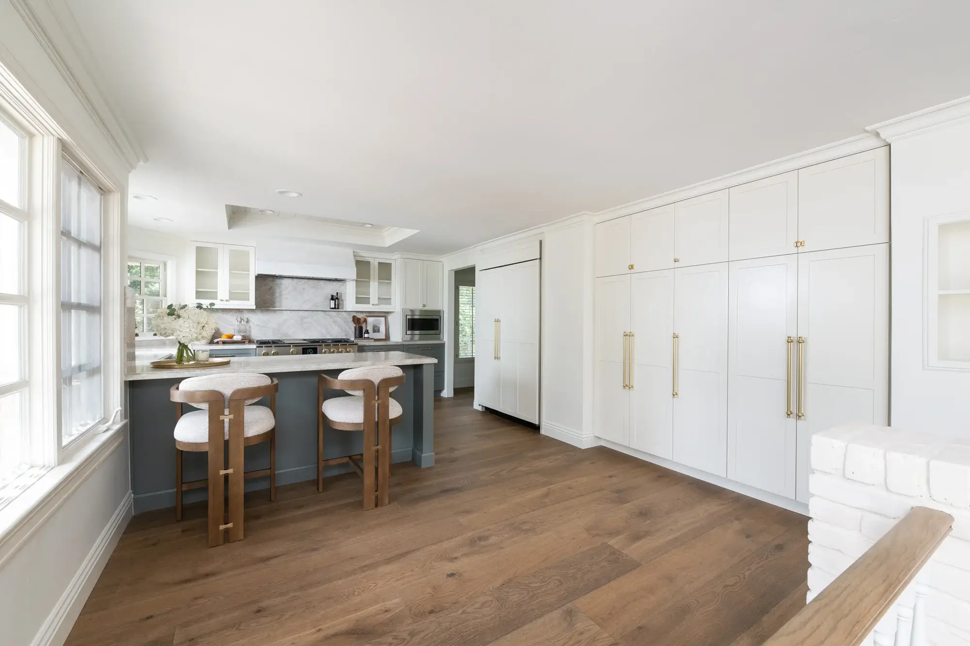 upper-cabinets-and-paneled-fridge-and-freezer-and-pantry-cabinets-in-Kemper-maple-wood-in-Painted-Coconut-finish