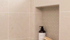 shower-includes-a-shampoo-niche-and-bench-seat
