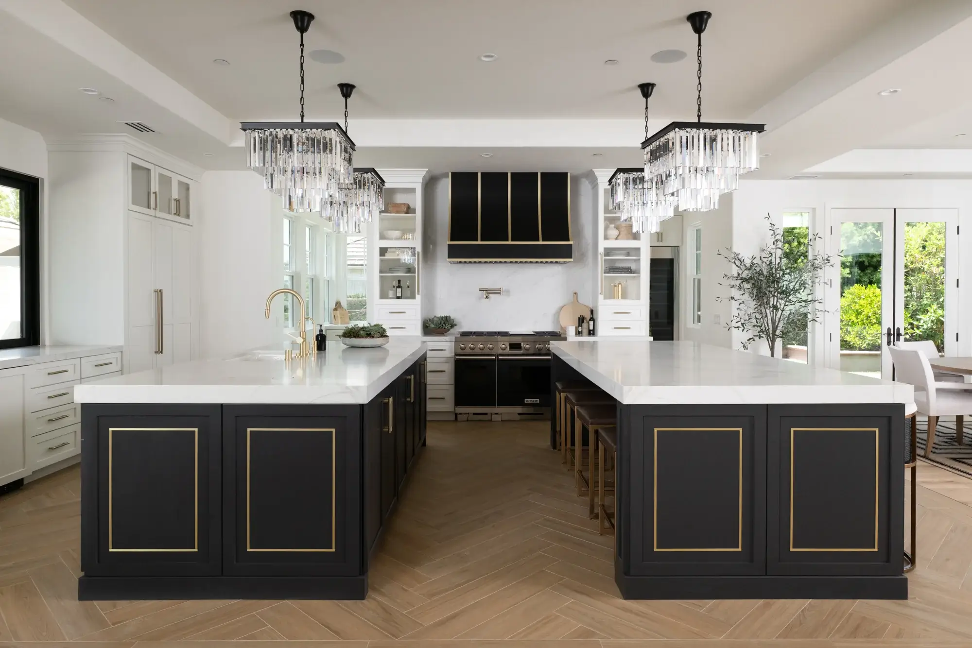 two-peninsulas-and-an-island-were-reimagined-into-2-large-islands-1-includes-seating-for-8-the-other-includes-a-sink-paneled-dishwasher-and-additional-storage