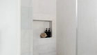 back-shower-wall-and-flooring-in-mosaic-natural-stone-and-heavy-rain-Thassos-marble-in-crisp-white