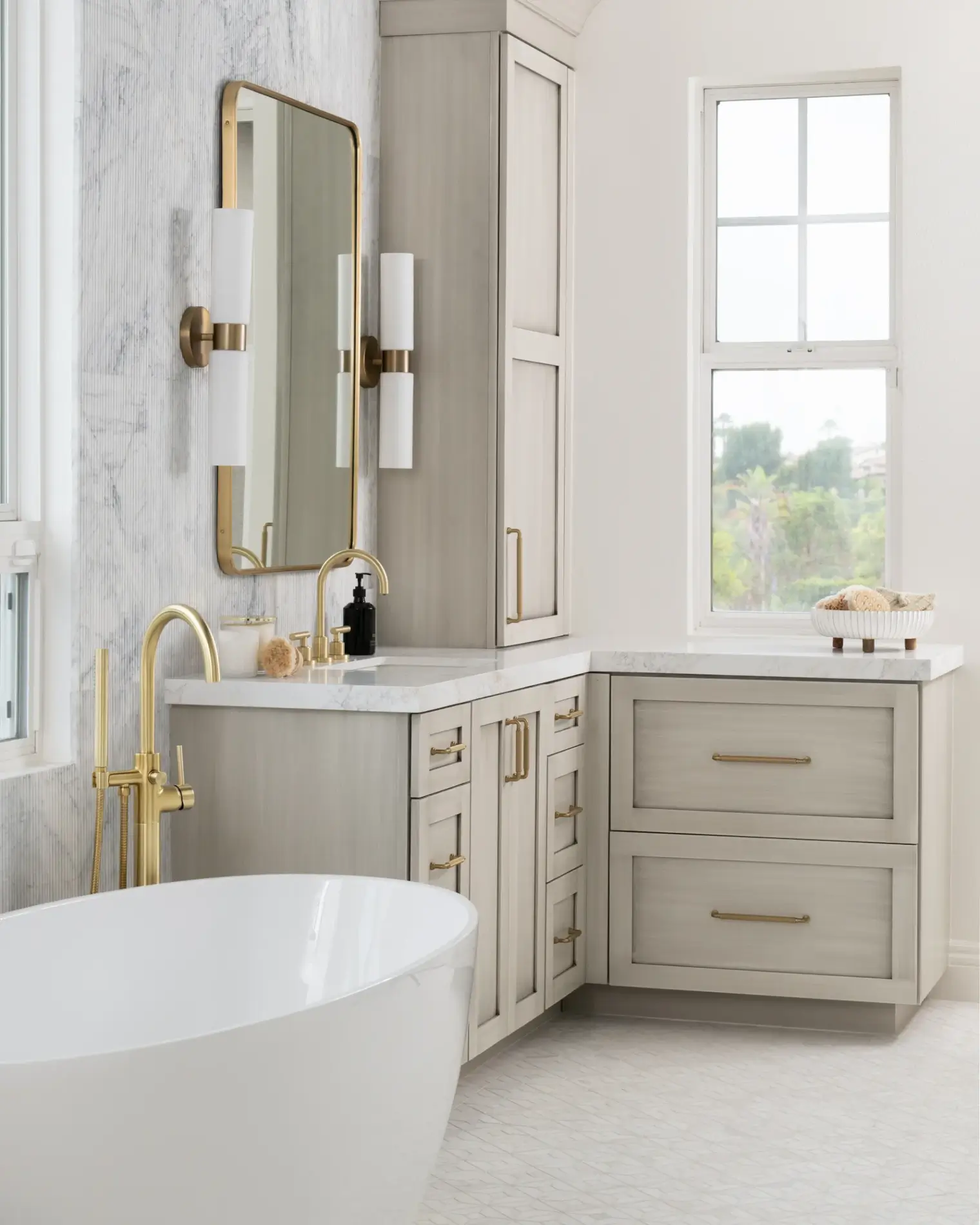 Fleurco-Voce-Grande-freestanding-tub-in-white-with-satin-brass-floor-mount-tub-filler