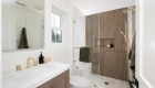 Omega-cabinetry-in-Chinchilla-finish-with-quartz-countertops-in-polished-Golden-Scribe-finish
