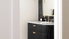 powder-bath-remodel-with-full-wall-marble-tile-backsplash-by-Waves-series-in-Nero-finish-and-marble-tile-flooring-in-Calcatta-tulip-black