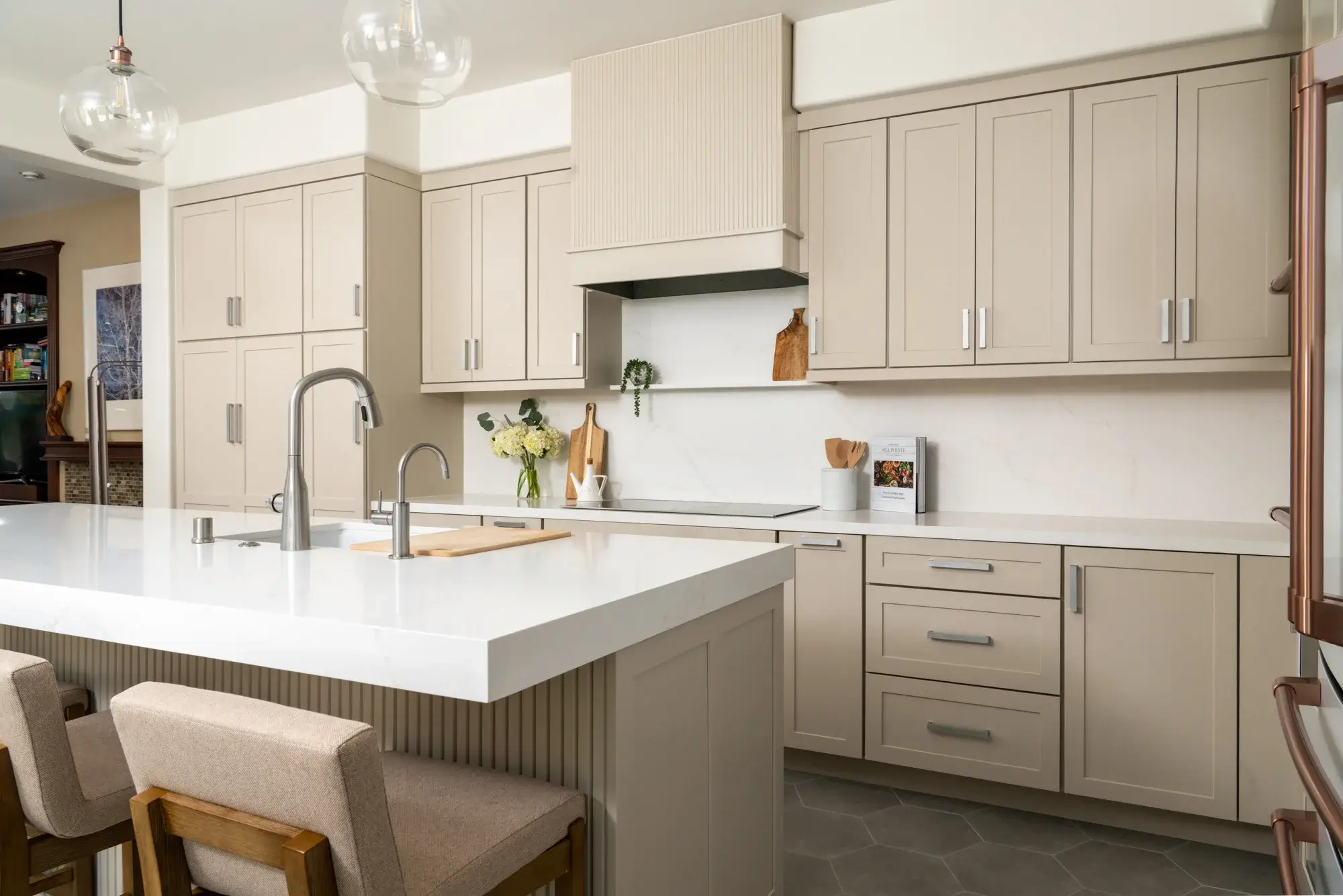 Omega-cabinetry-in-Chinchilla-finish-with-quartz-countertops-in-polished-Golden-Scribe-finish